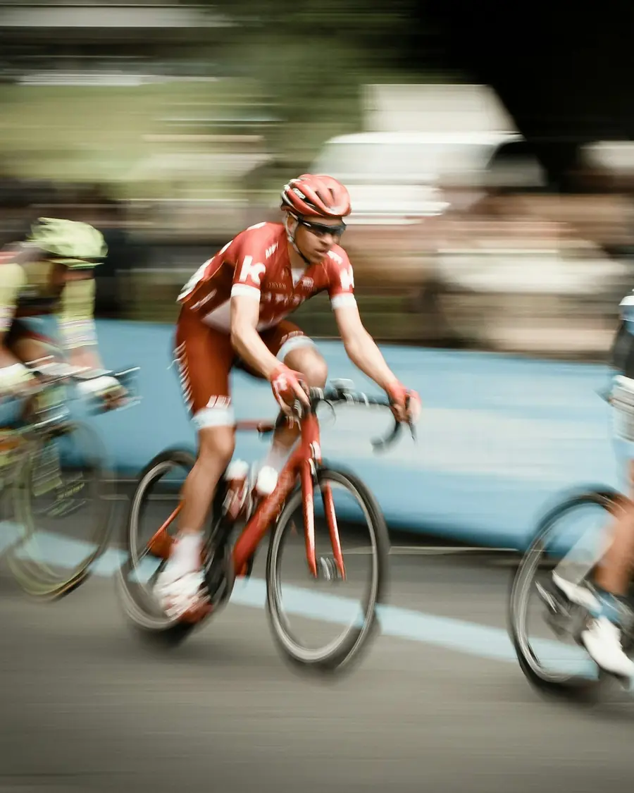 Road cyclists racing past in a blur